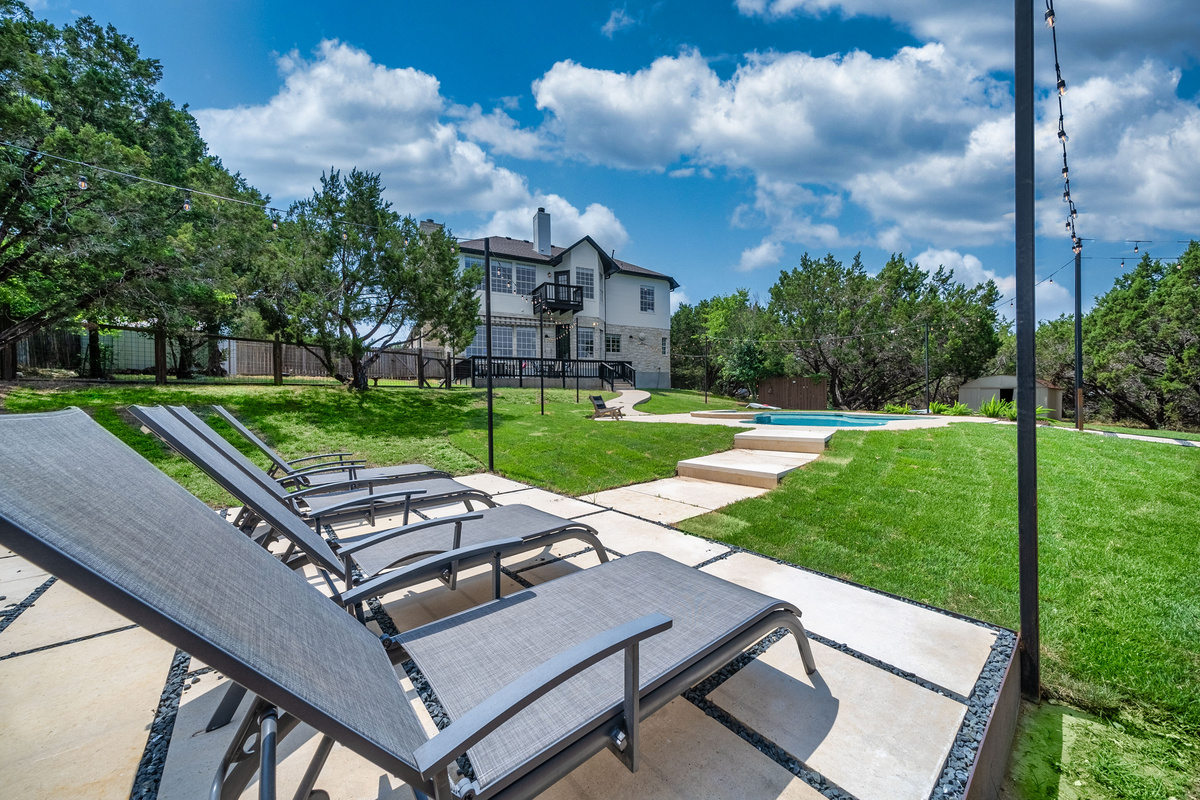 Lounge chairs line the poolside patio for all-day sunbathing