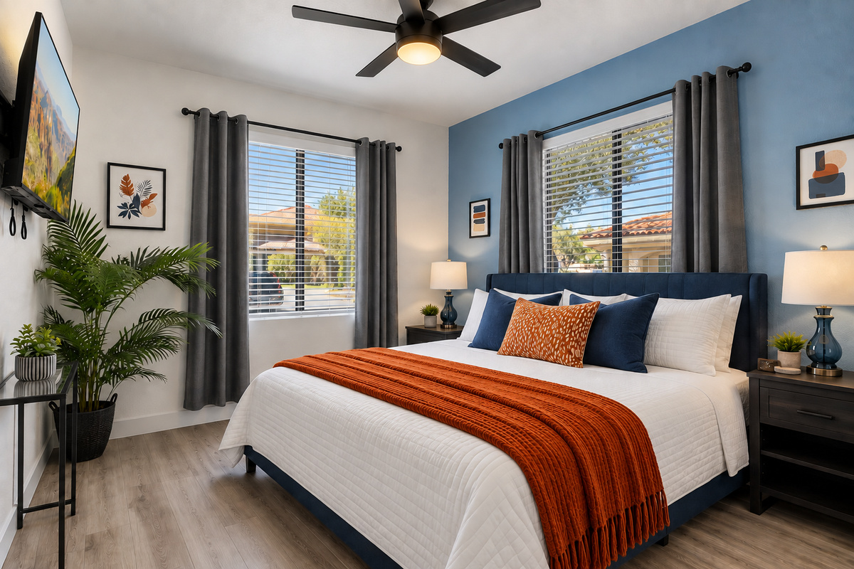 “Bright, airy bedroom with modern furnishings and cozy atmosphere.”