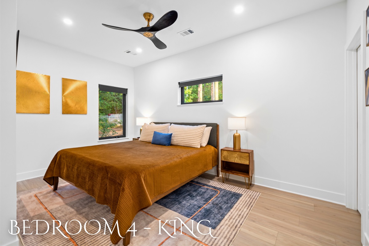Relax in luxury with this spacious king bedroom. Modern design meets ultimate comfort.