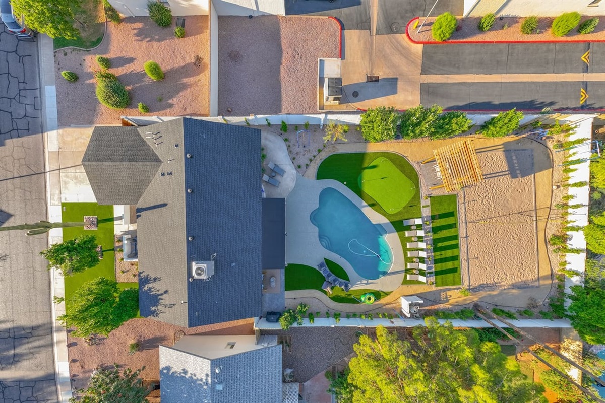See the stunning exterior of the house, showcasing its unique architecture and beautifully landscaped surroundings for a warm and inviting atmosphere.