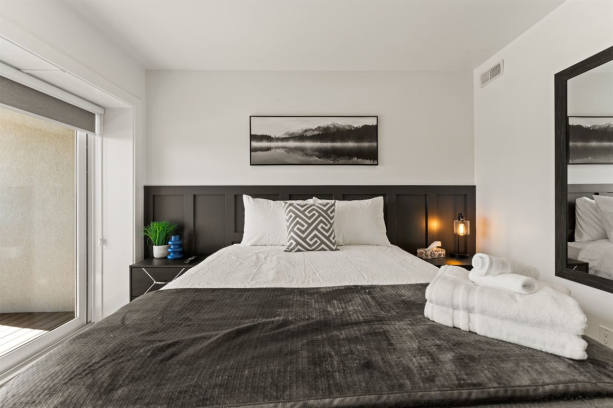 Queen Bedroom with Minimalist artwork keeps focus on the space.