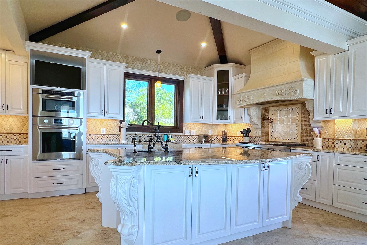 Double ovens and expansive counters cater to every culinary need.