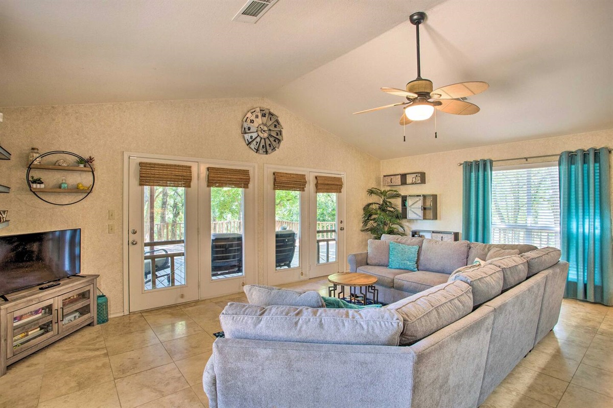 Living room with access to outside patio and deck.