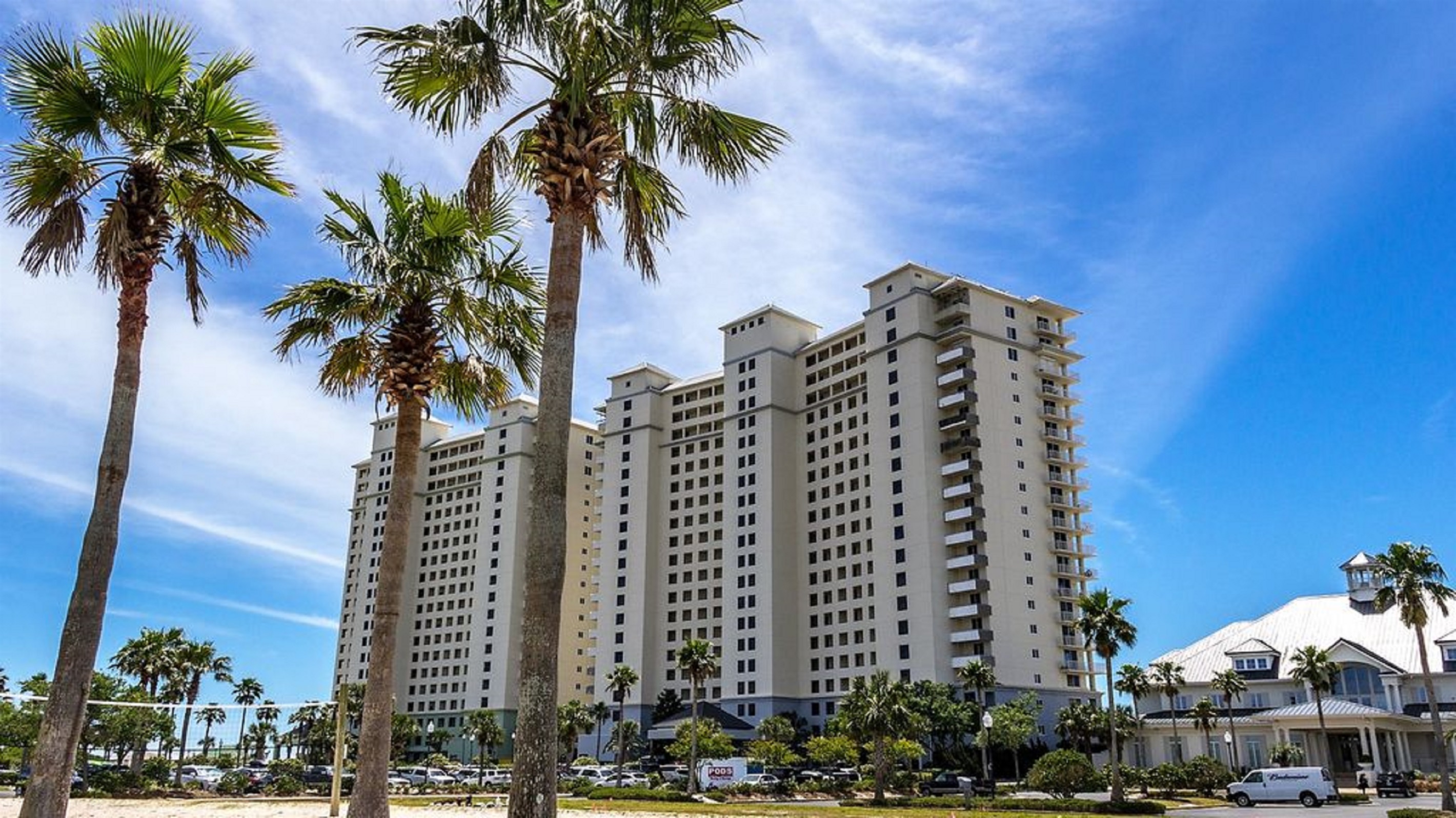 This prominent beachfront building stands as a testament to coastal architecture, providing residents and guests with an unparalleled seaside experience.