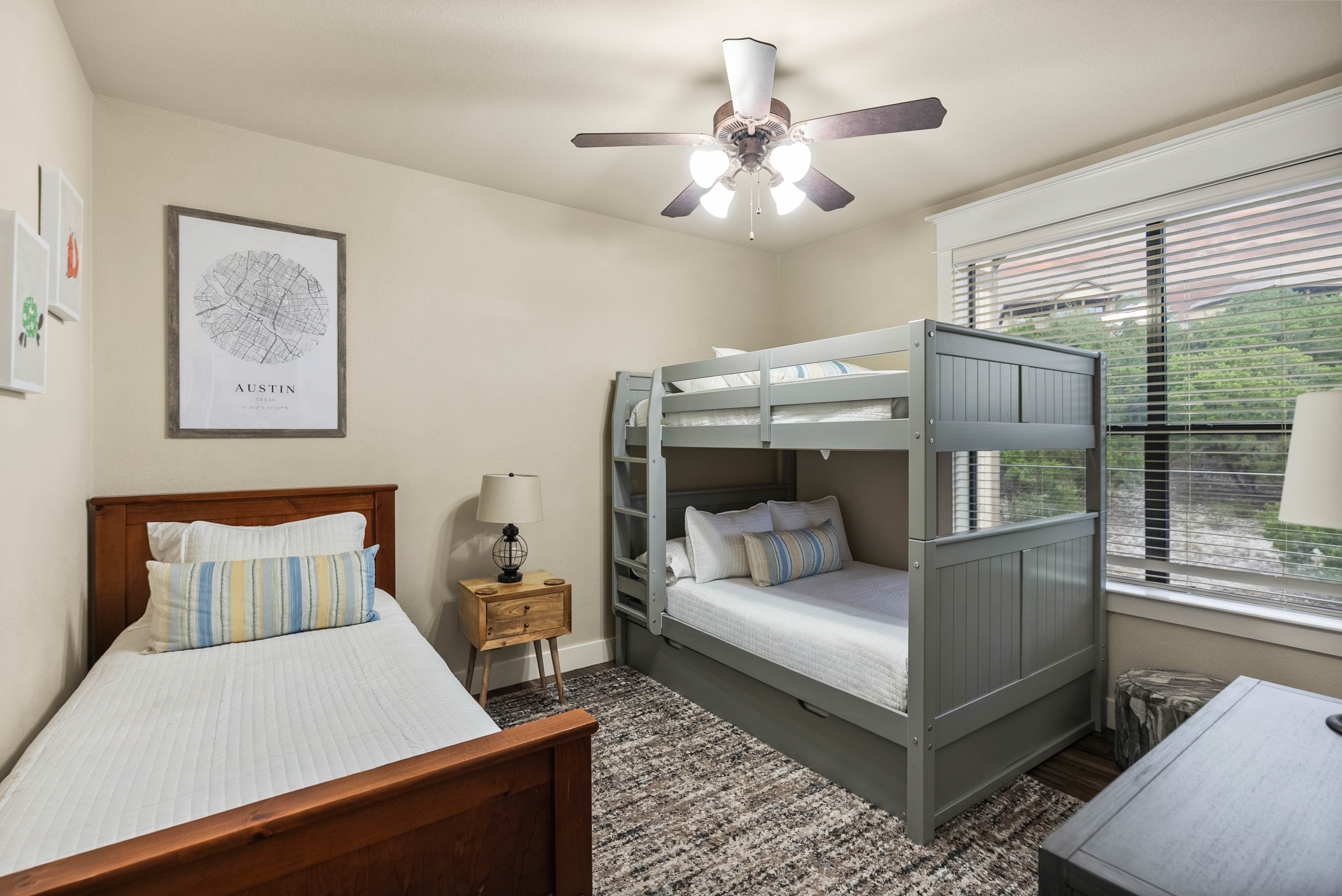 A flexible sleeping space for kids or groups featuring a full-over-full bunk bed with a twin trundle, plus a separate twin bed.