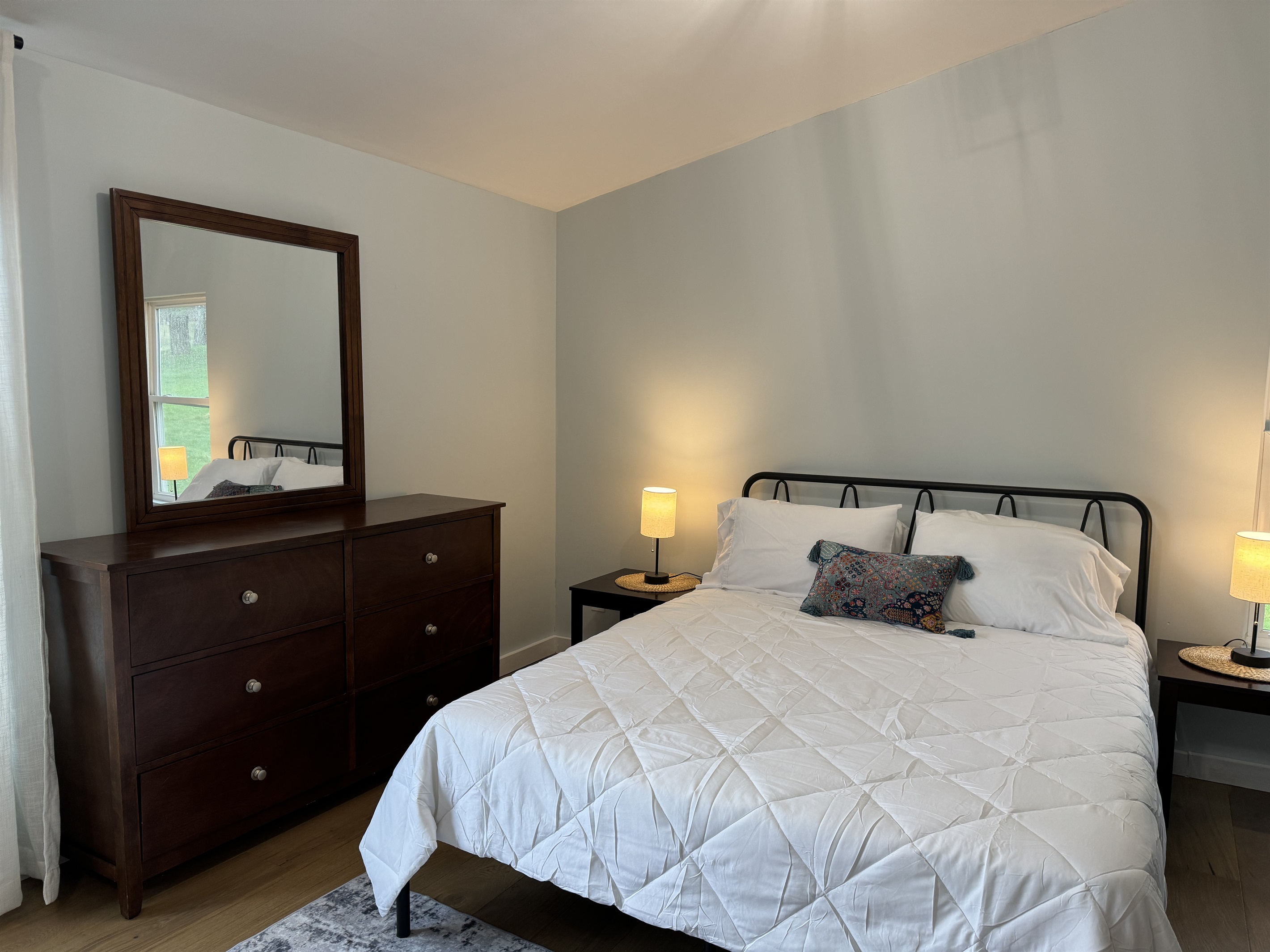 Primary Queen bedroom with desk and lounge area