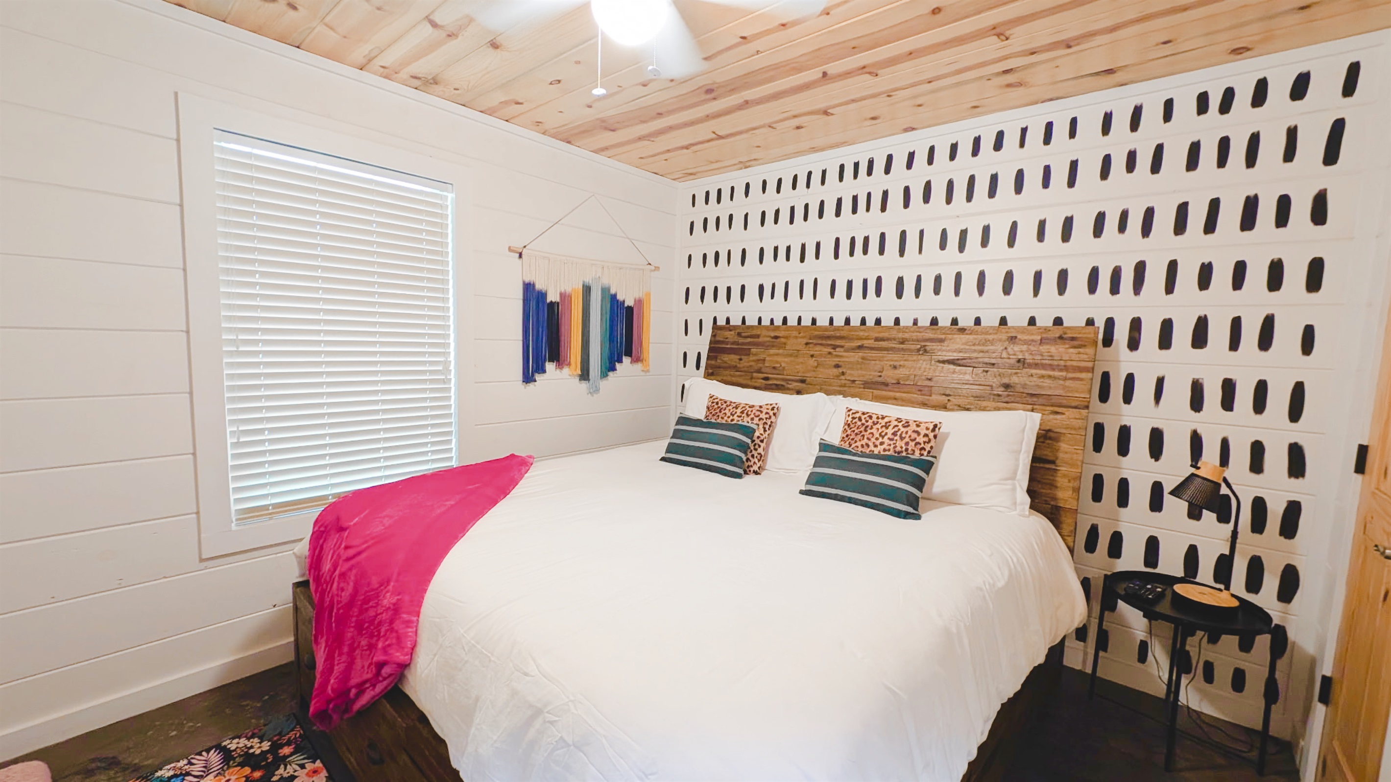 Boots + Beats | King bedroom 2 (sleeps 2). The second king room, plus four roll-out twin beds in the loft, make eight guests total.