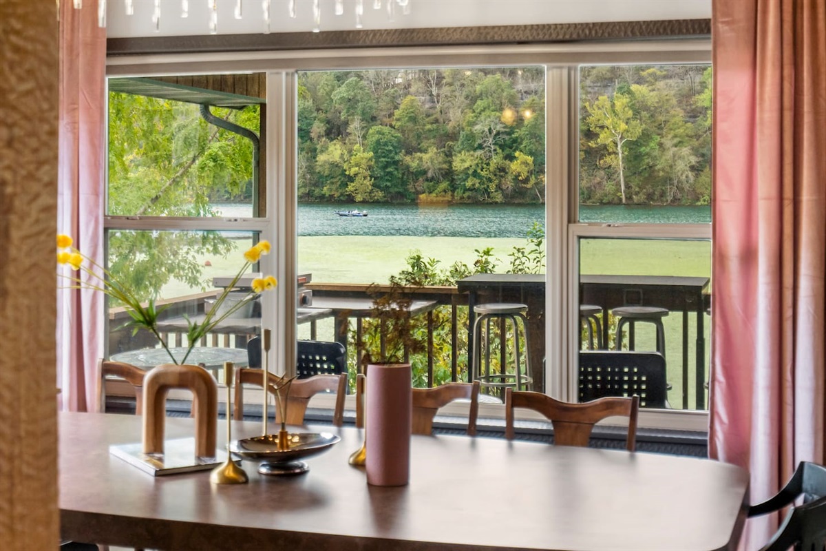 Elegant dining for 12-14 people with lake view.