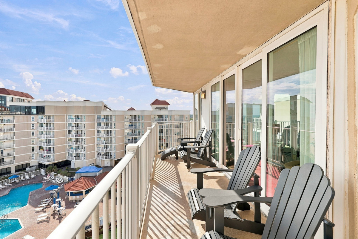 Soak in the sun and pool views right from your private balcony chairs.