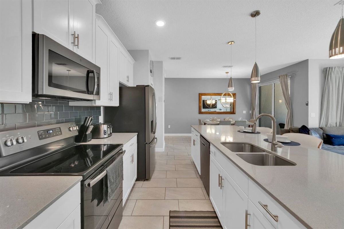 The open kitchen area is fully equipped for you to cook during your stay