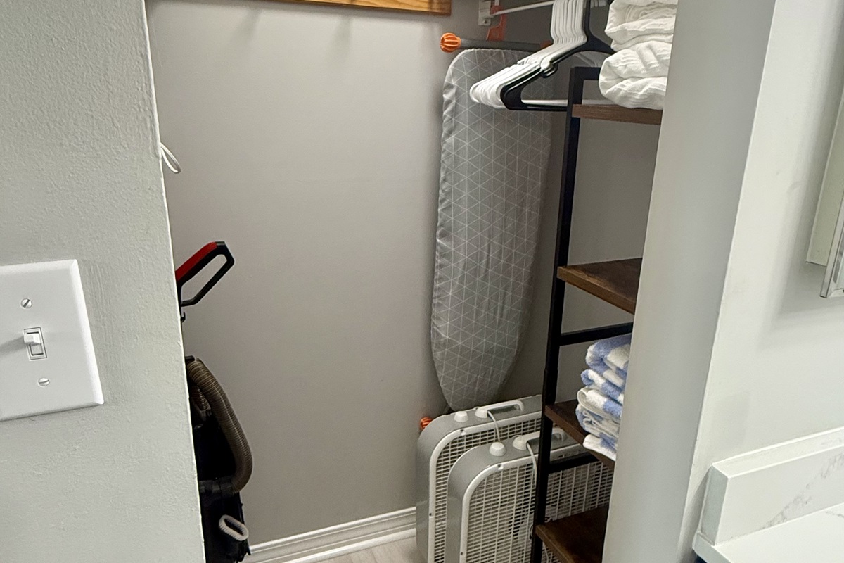 Walk-in Closet with Iron, Ironing Board, and Extra Fans
