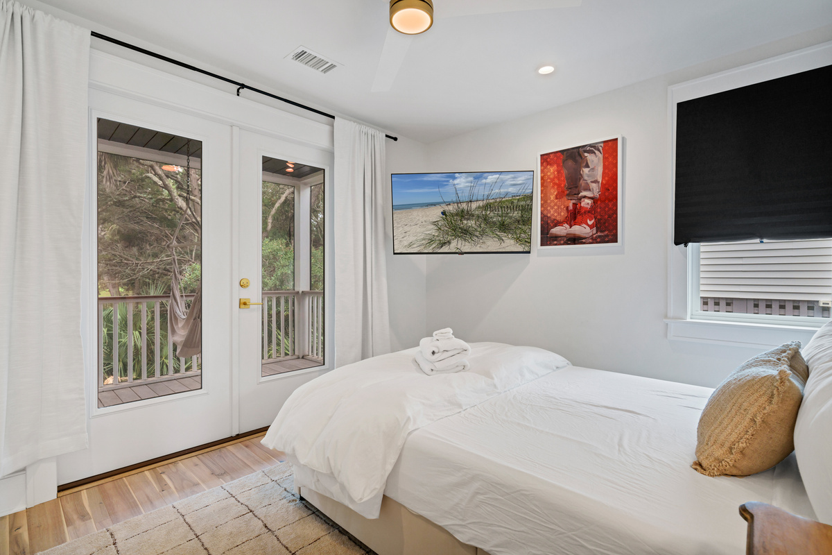 Guest Bedroom 3 with Queen Bed, TV and private entrance to deck. 