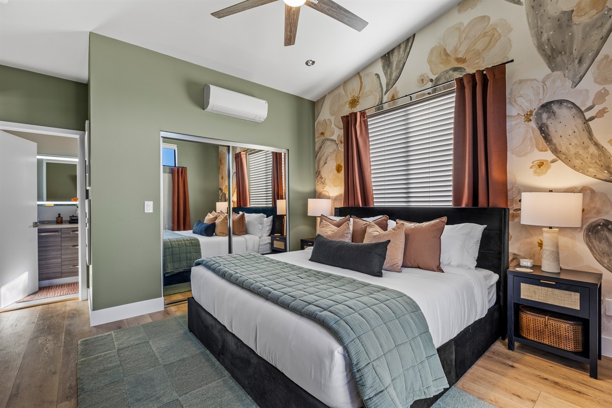 A calm, well-appointed primary bedroom with ensuite access, creating a relaxed and private retreat. 