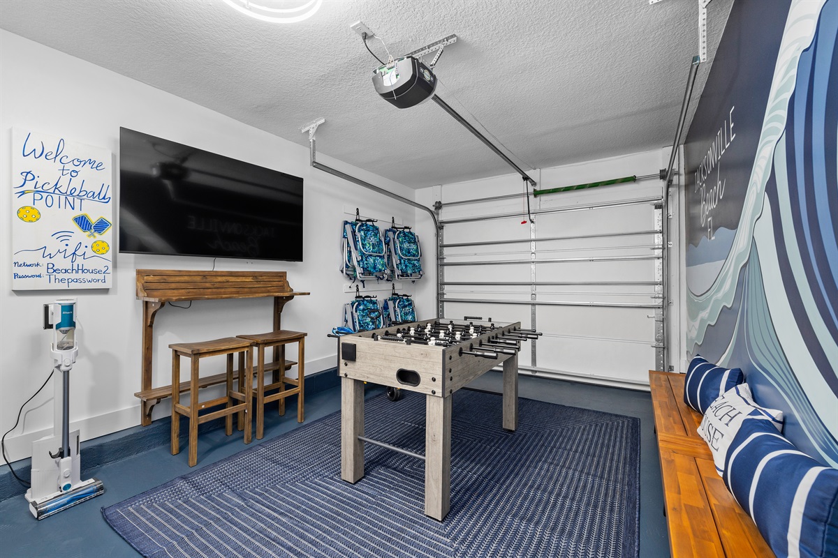 A fun retreat for all ages featuring foosball, seating, and a TV for game nights or rainy afternoons