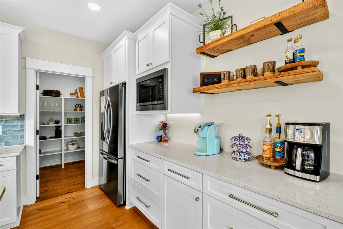 Coffee lovers will love our mini coffee bar in the kitchen. we offer a great selection of specialty coffee syrups as well as a Keurig, pods, coffee, grinder, and regular drip coffee maker.