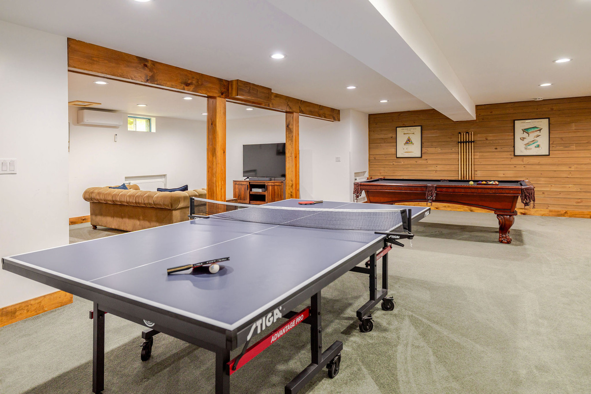 Challenge family and friends to ping pong or a game of pool in the spacious lower-level recreation room designed for hours of indoor fun.
