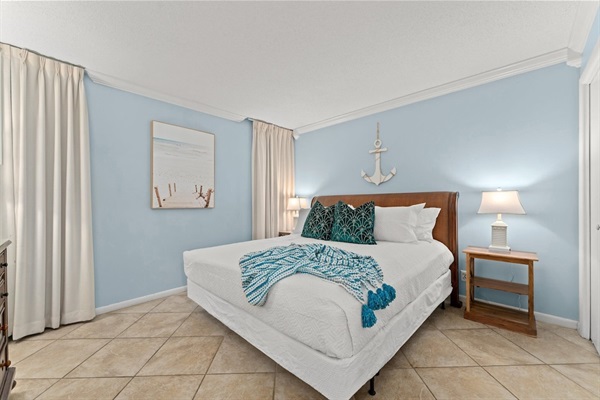 Indulge in the royal treatment of our king-size bed and snooze like a champ with blackout shades posing as elegant drapery.
There is an additional TV in the master bedroom. 
