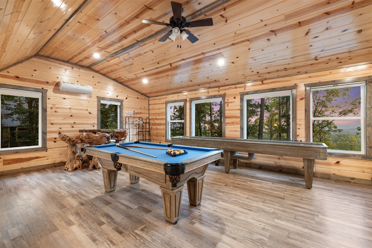 Bright entertainment loft with large windows and beautiful mountain scenery