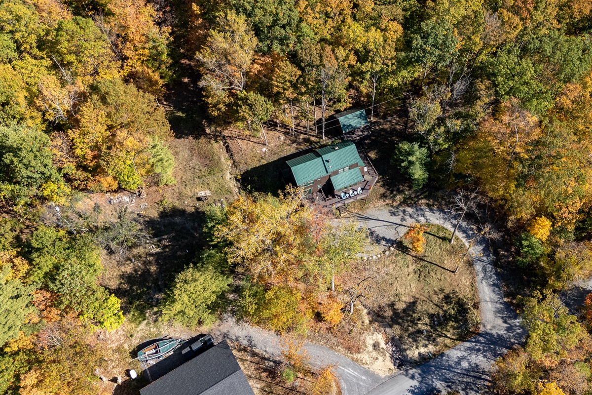 Front view entrance and parking area, tucked in the woods yet minutes from the dock.