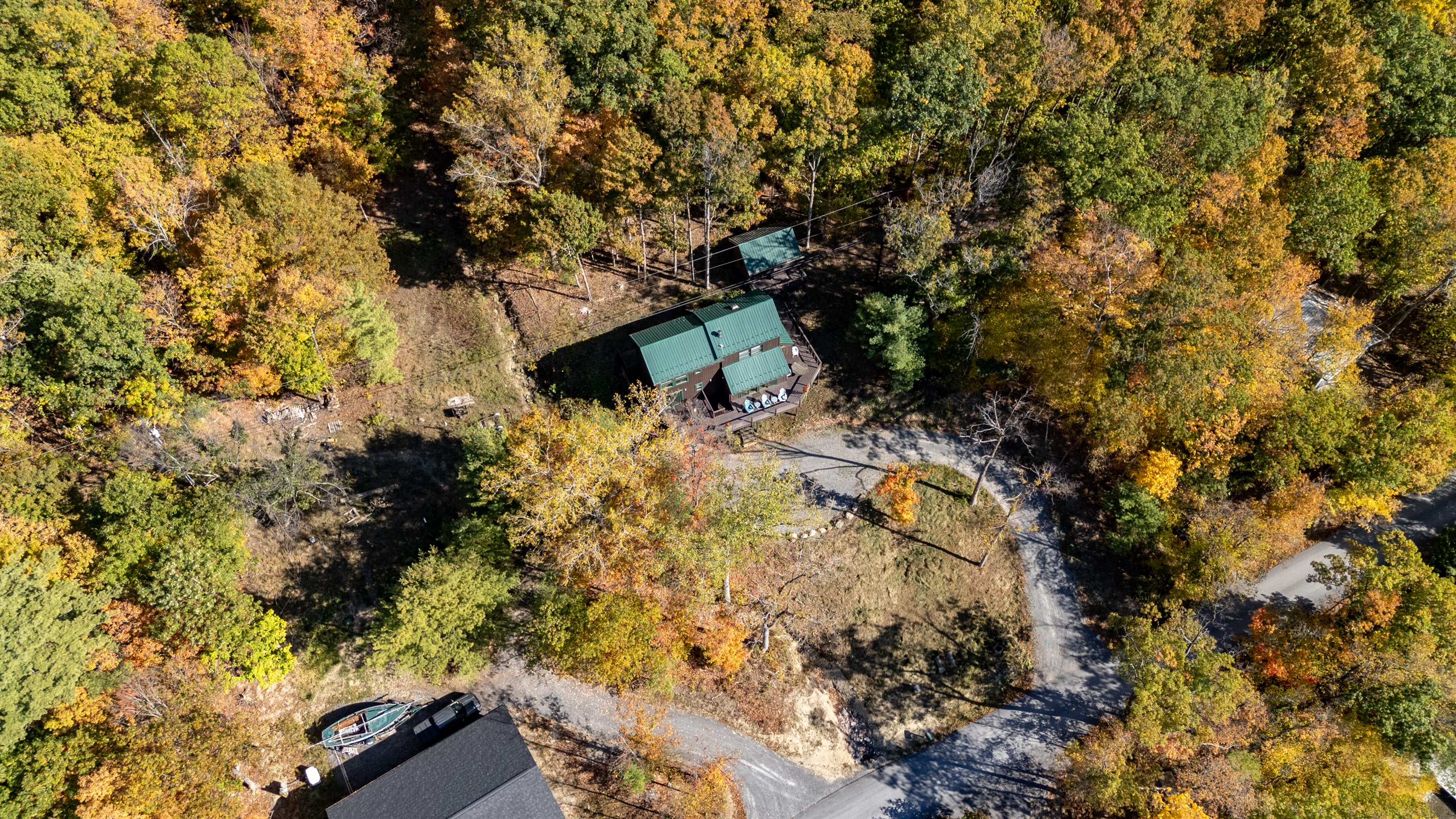 Front view entrance and parking area, tucked in the woods yet minutes from the dock.