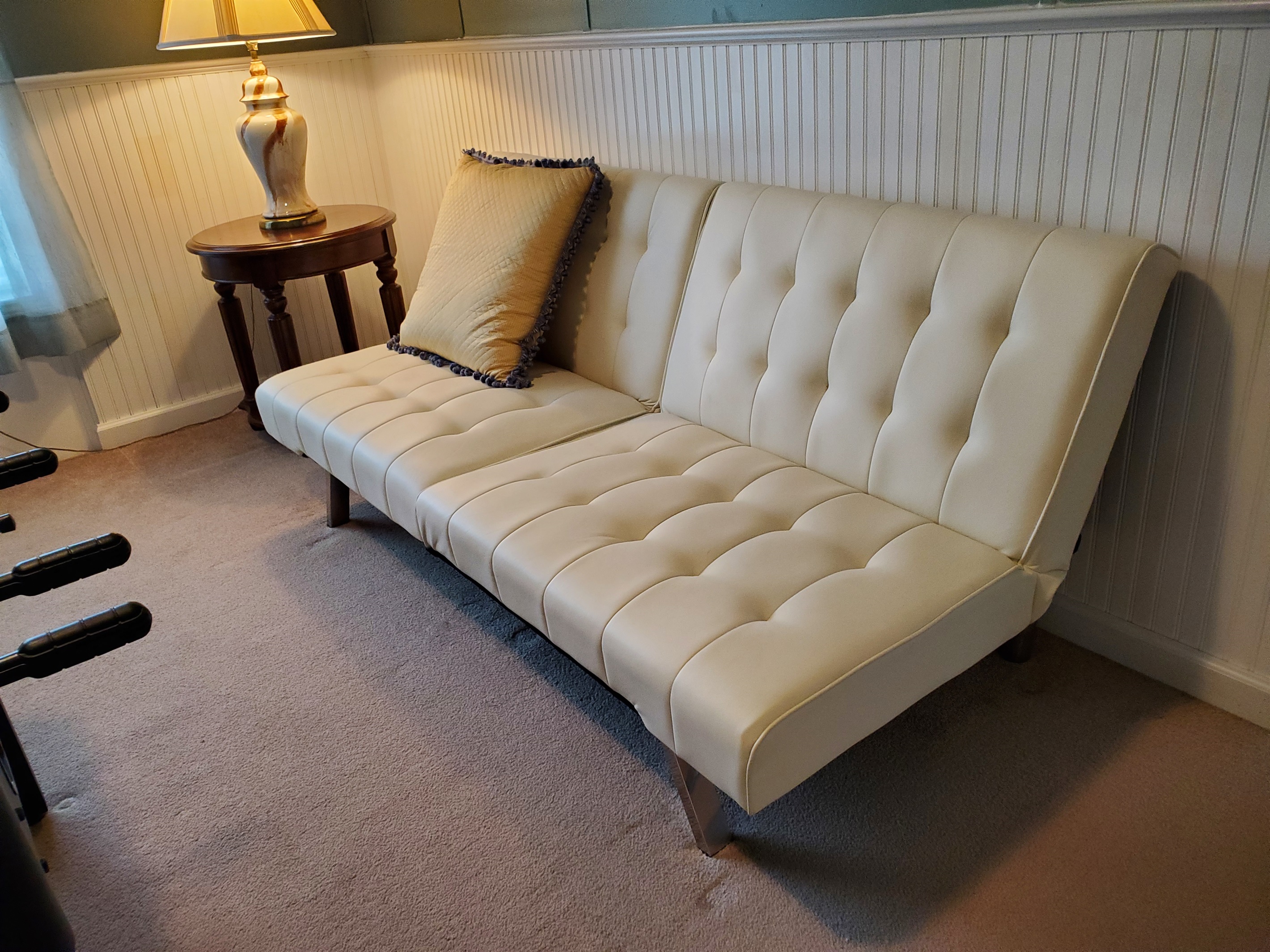 Click-clack bed in den for extra sleeping