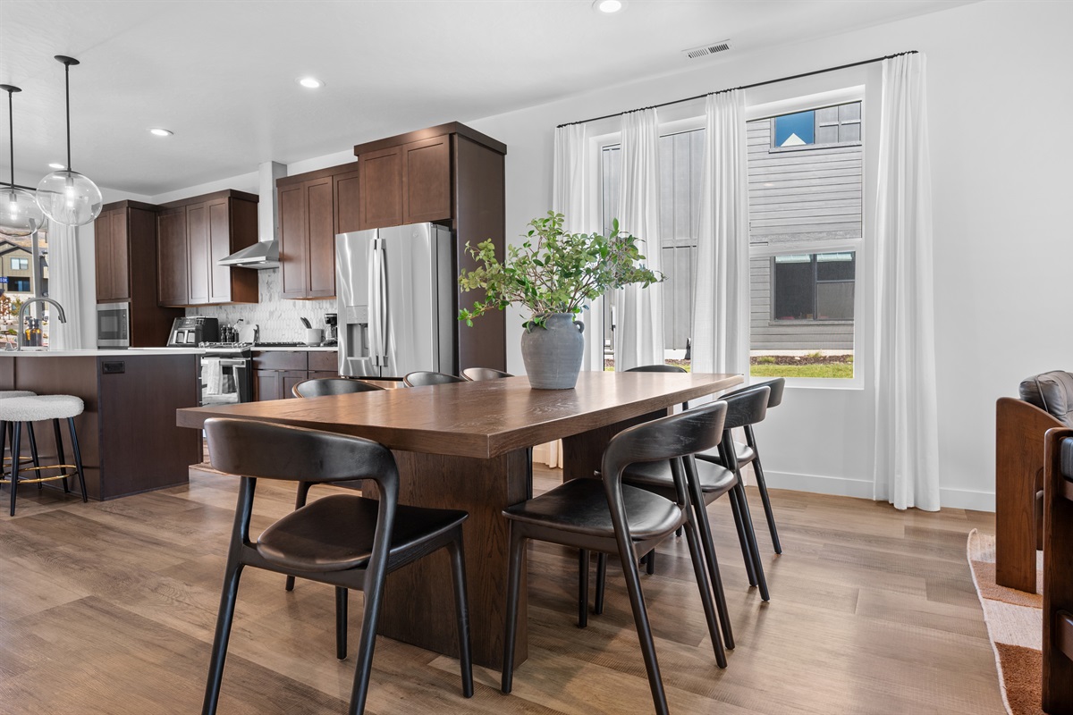 The spacious dining table for 8 is perfect for gathering with family and friends