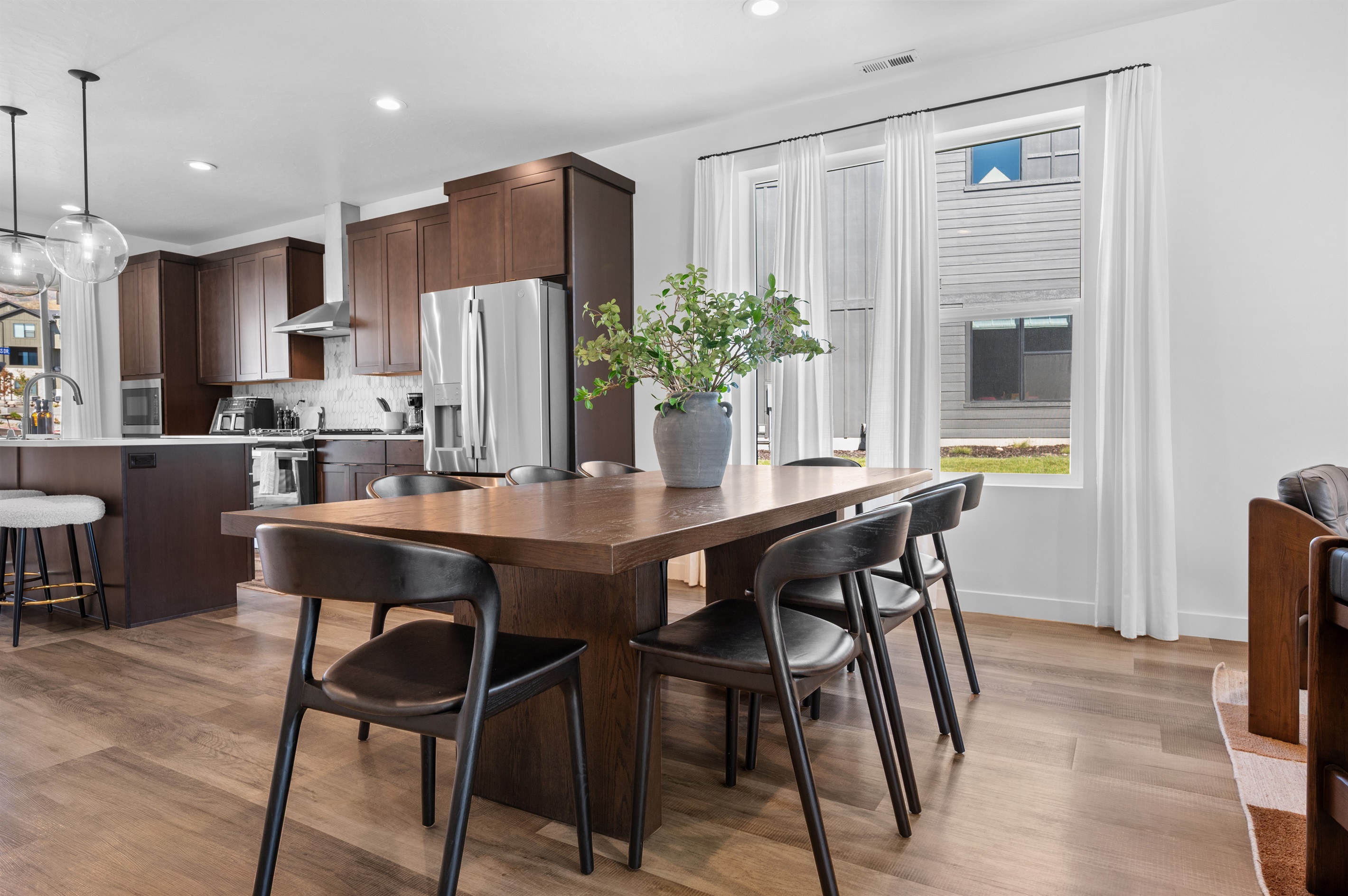 The spacious dining table for 8 is perfect for gathering with family and friends