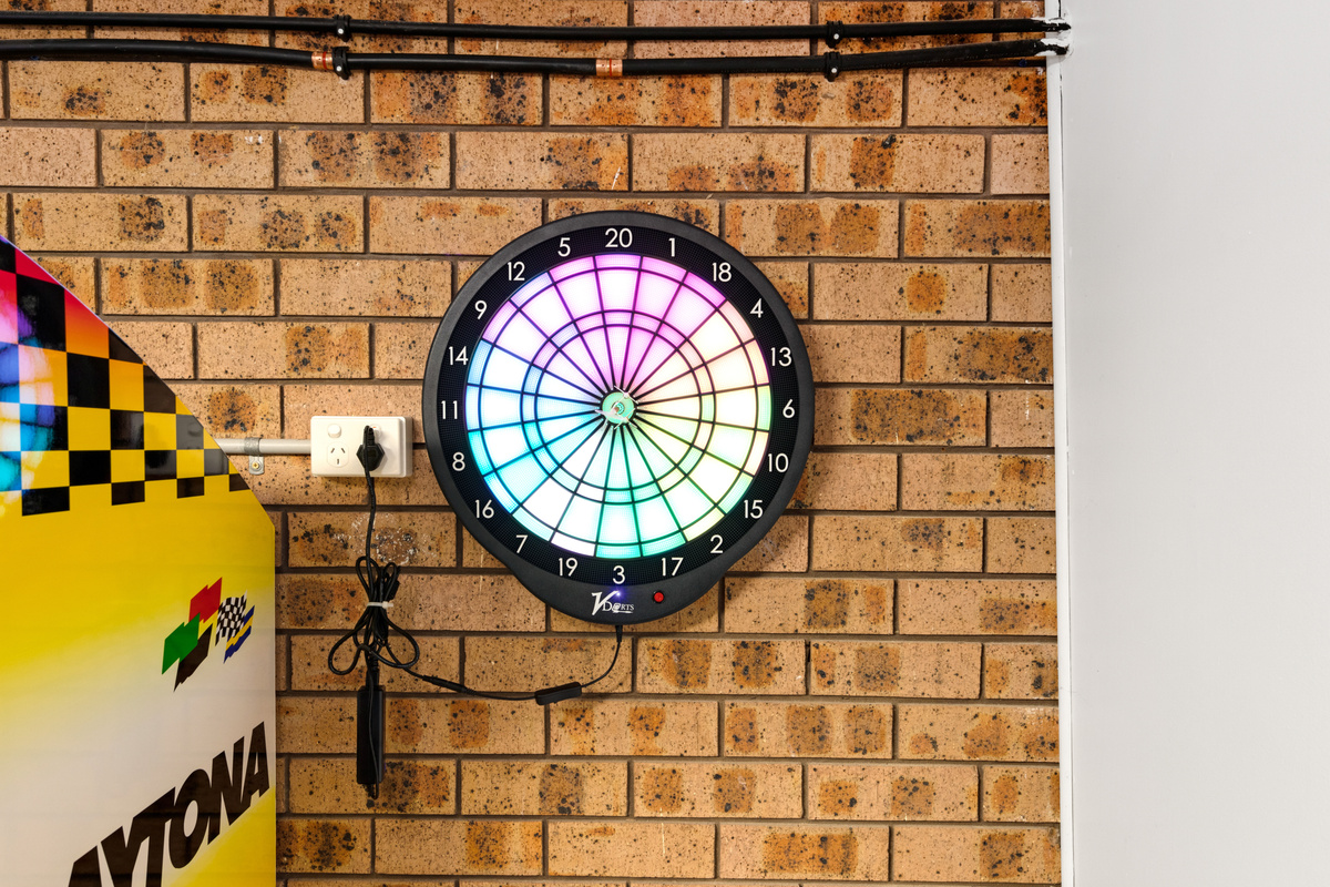 The digital darts setup adds another layer to the activity-packed games room at Skye’s Beach House Malua Bay.
