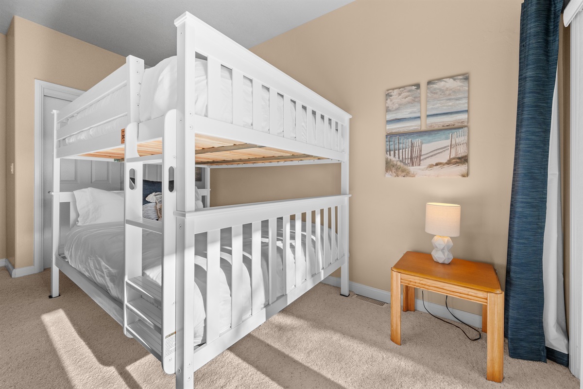 Fun and functional bunk room with queen-over-queen beds—ideal for groups or families.