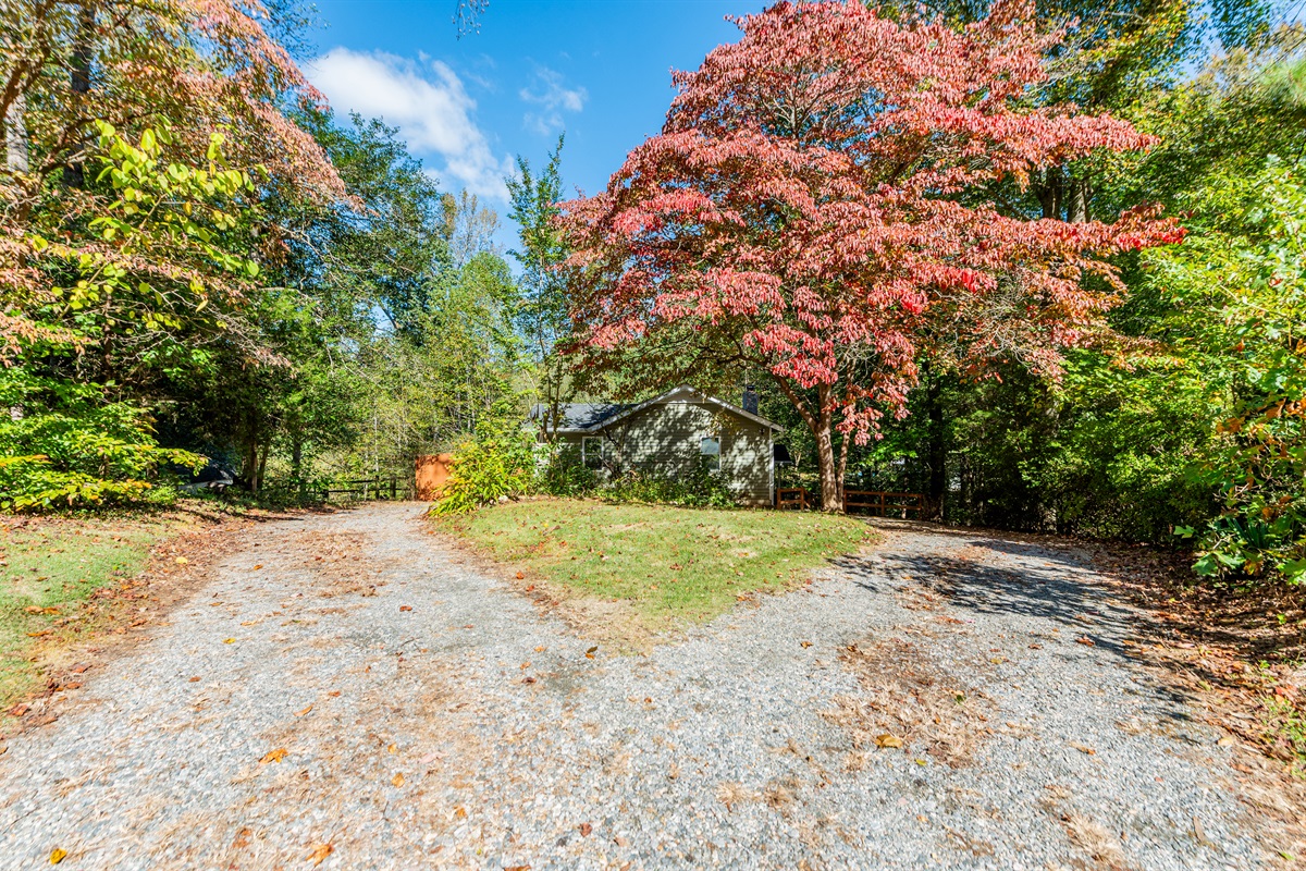 Arrive to vibrant foliage and a serene pathway in beautiful Quinton!