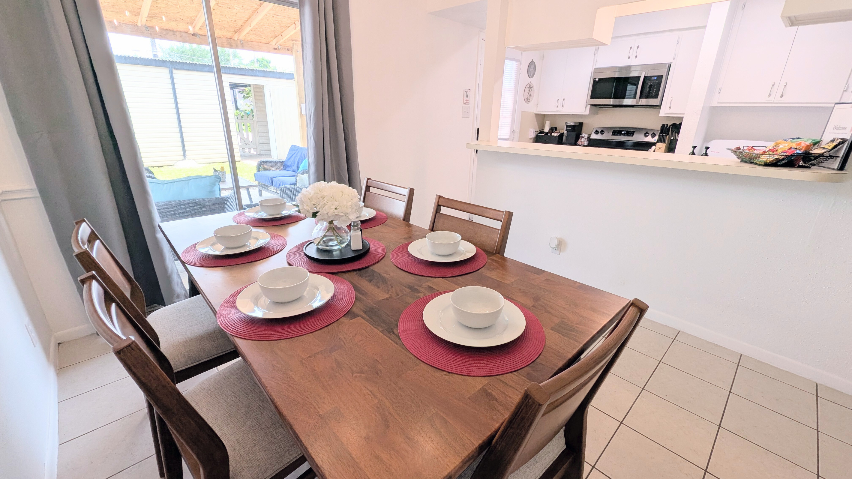 Enjoy easy access from the dining room to the charming outdoor courtyard and well-equipped galley kitchen.