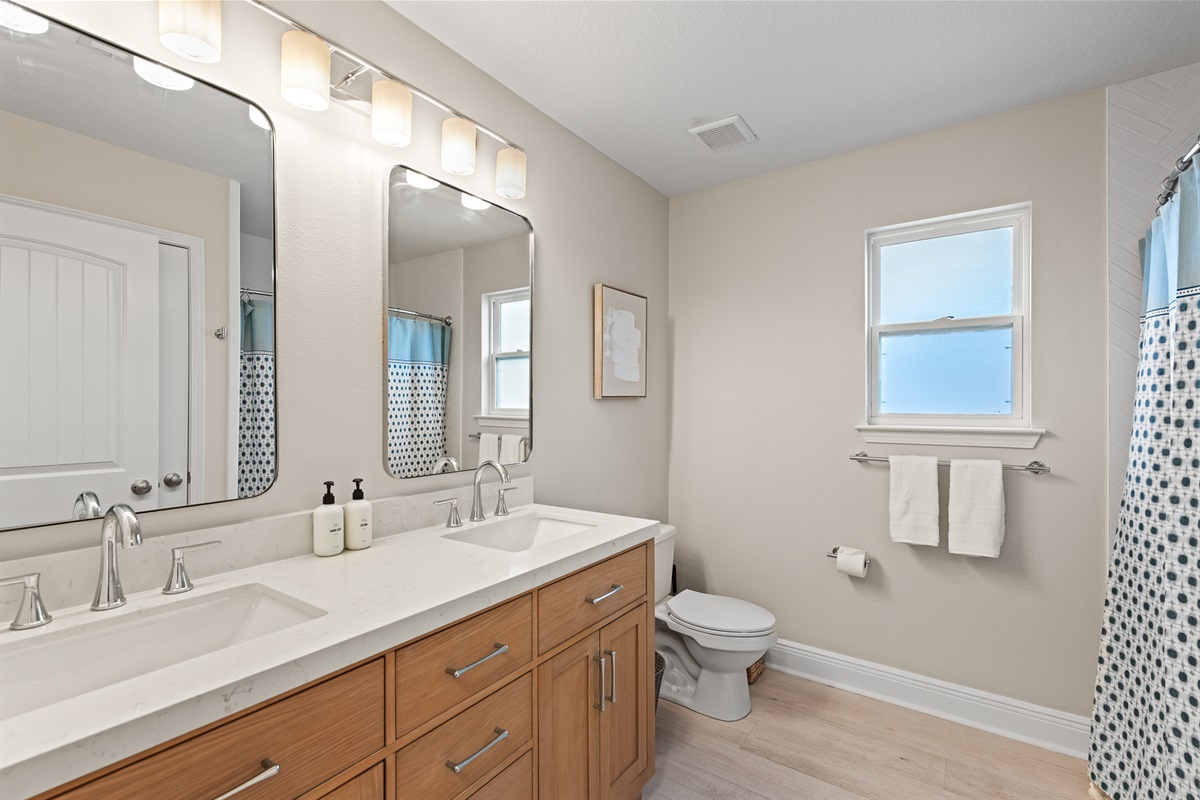 2nd Floor Full Bath: A sparkling, modern bathroom on the second floor that combines functional design with stylish finishes.