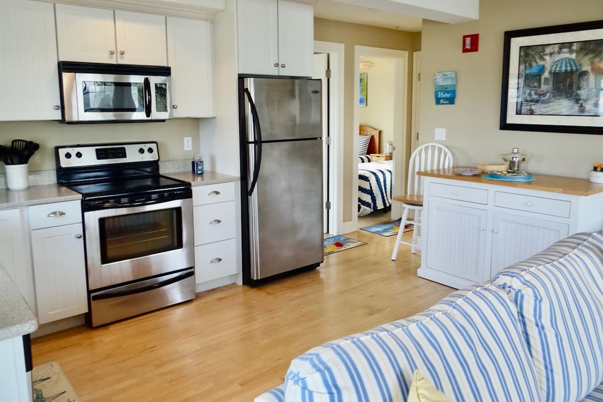 Kitchen view with little bar and seating