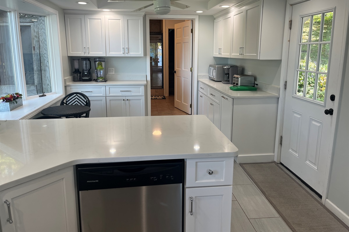 Kitchen with dishwasher, breakfast nook and 1st floor bath beyond