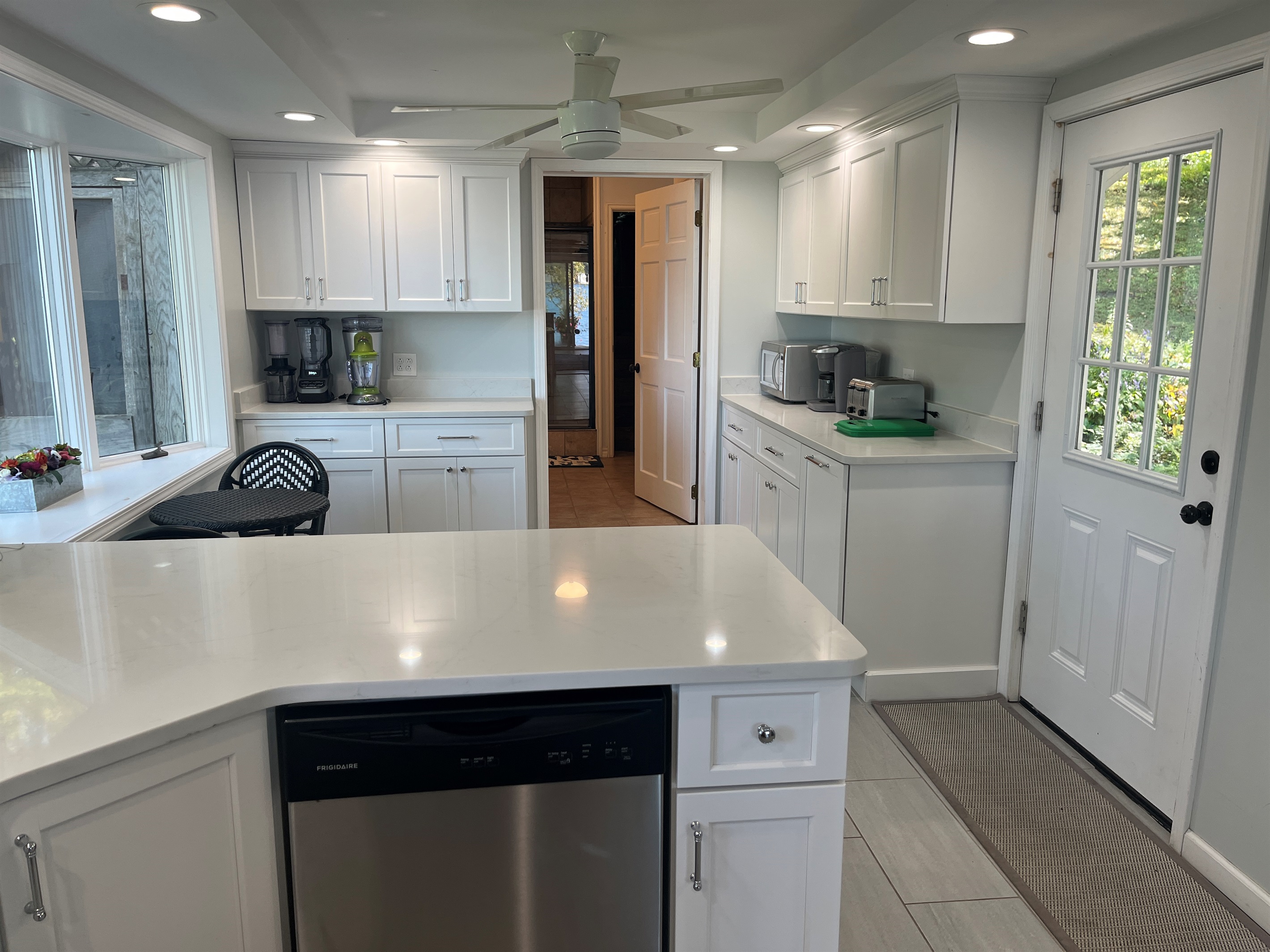 Kitchen with dishwasher, breakfast nook and 1st floor bath beyond