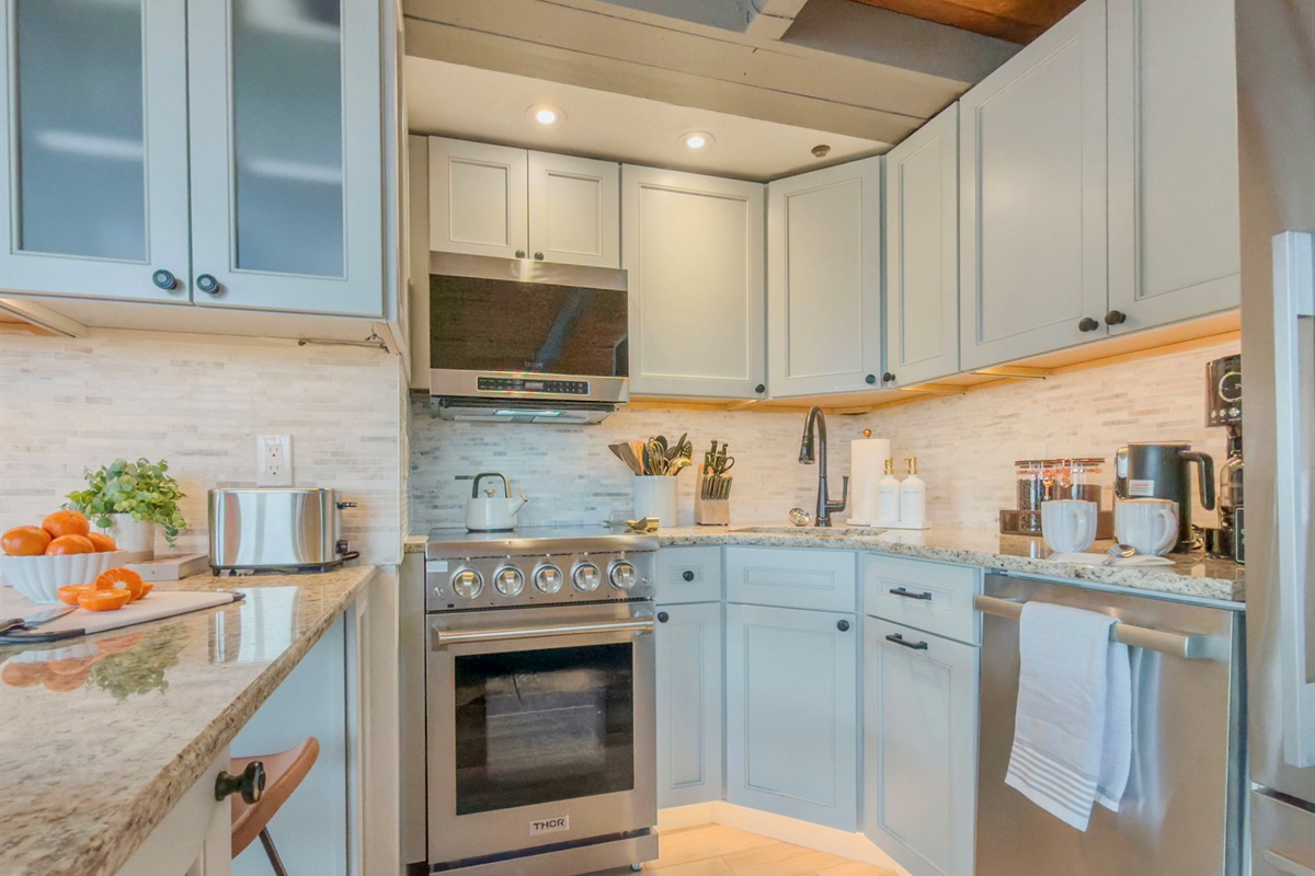 Ninja blender, wine cooler, essentials for cooking & baking, sharp knives, toaster, waffle maker, all the utensils you'd actually reach for - this kitchen will make cooking and bartending a pleasure, not a project.