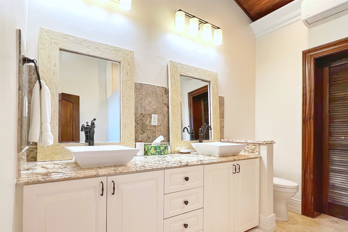 Pamper yourself in Bathroom 1 with double vanities and a spa-like vibe.