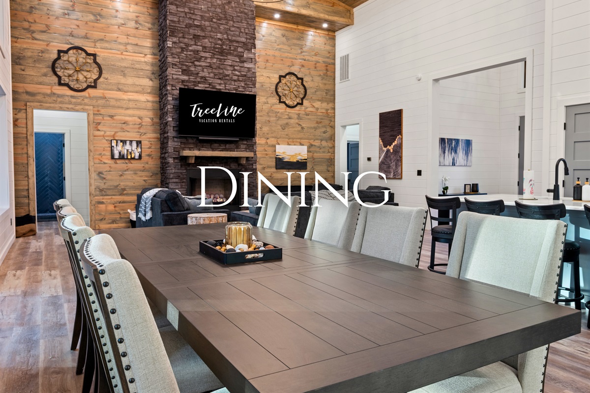 The large dining table invites the whole group to gather together for shared meals, game nights, or long conversations.