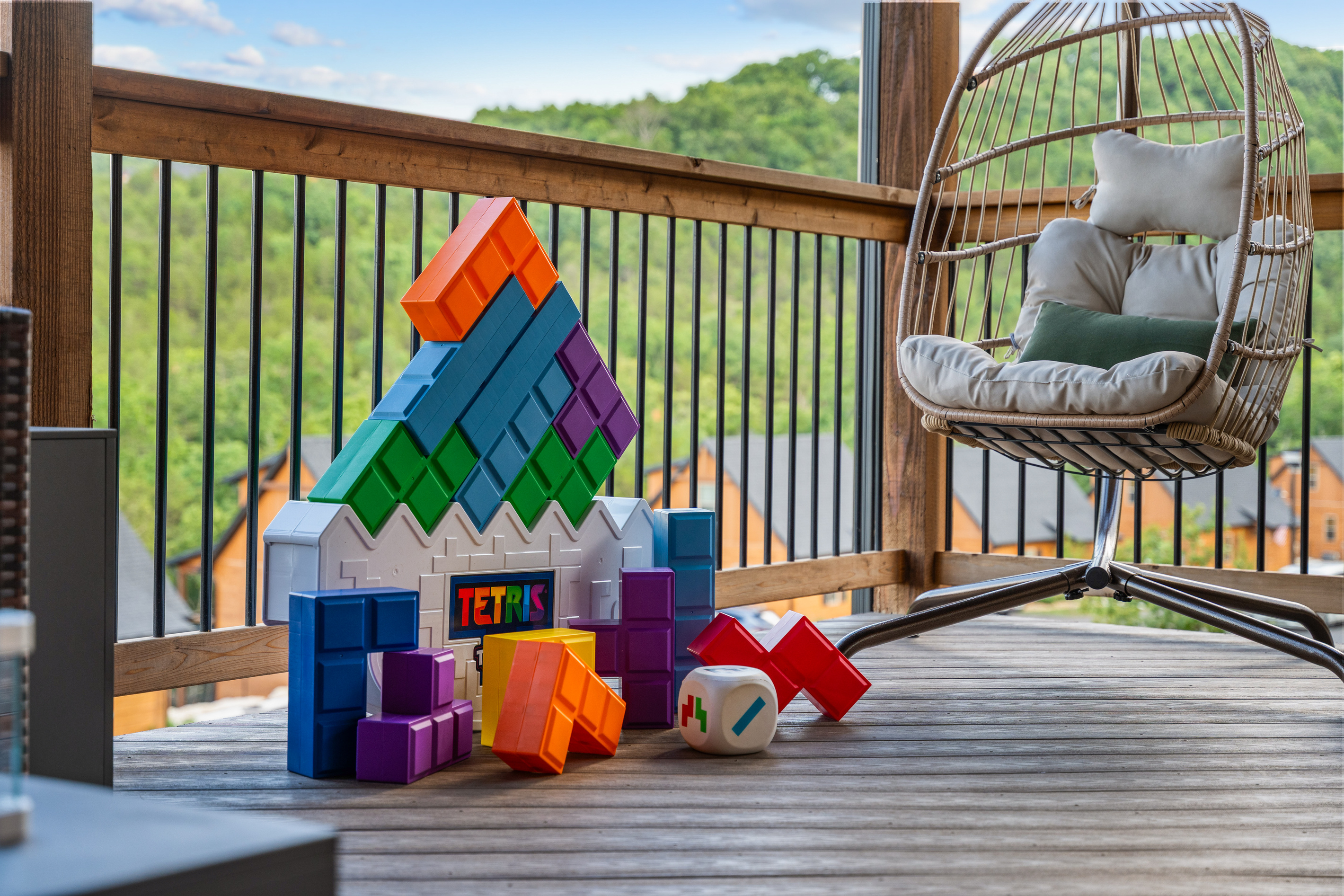 Giant Tetris blocks and a swaying egg chair prove the covered deck is built for all ages.