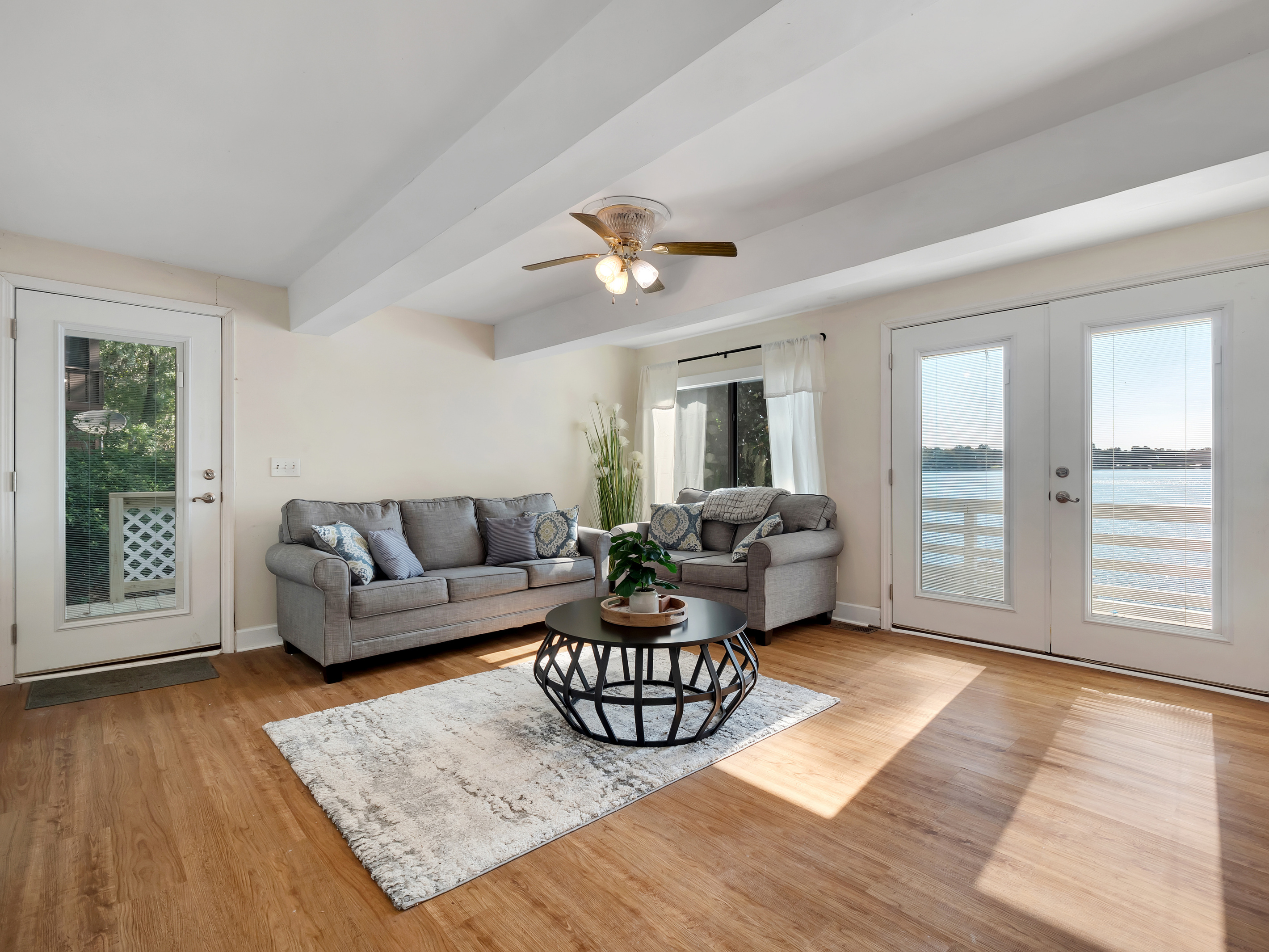 Lower portion living room.  4k tv, queen sleeper sofa, access to lower patio