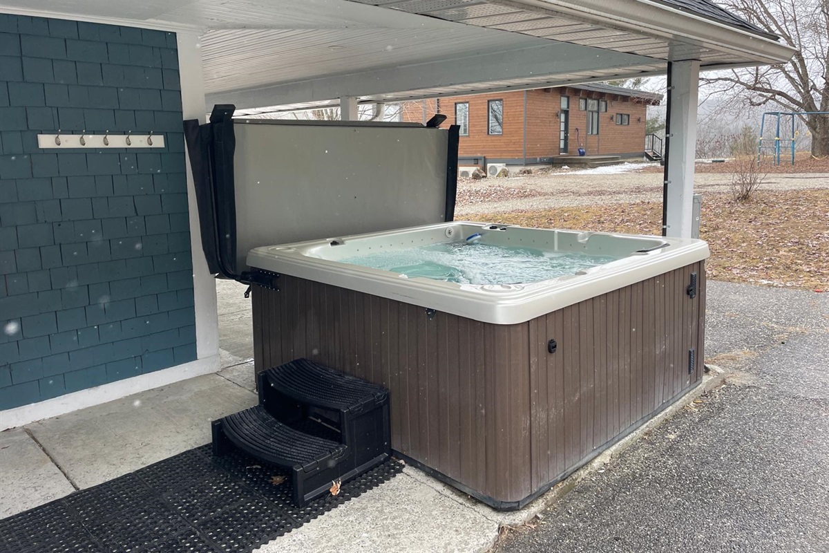 Hot Tub with cover retracted showing easy-access steps
