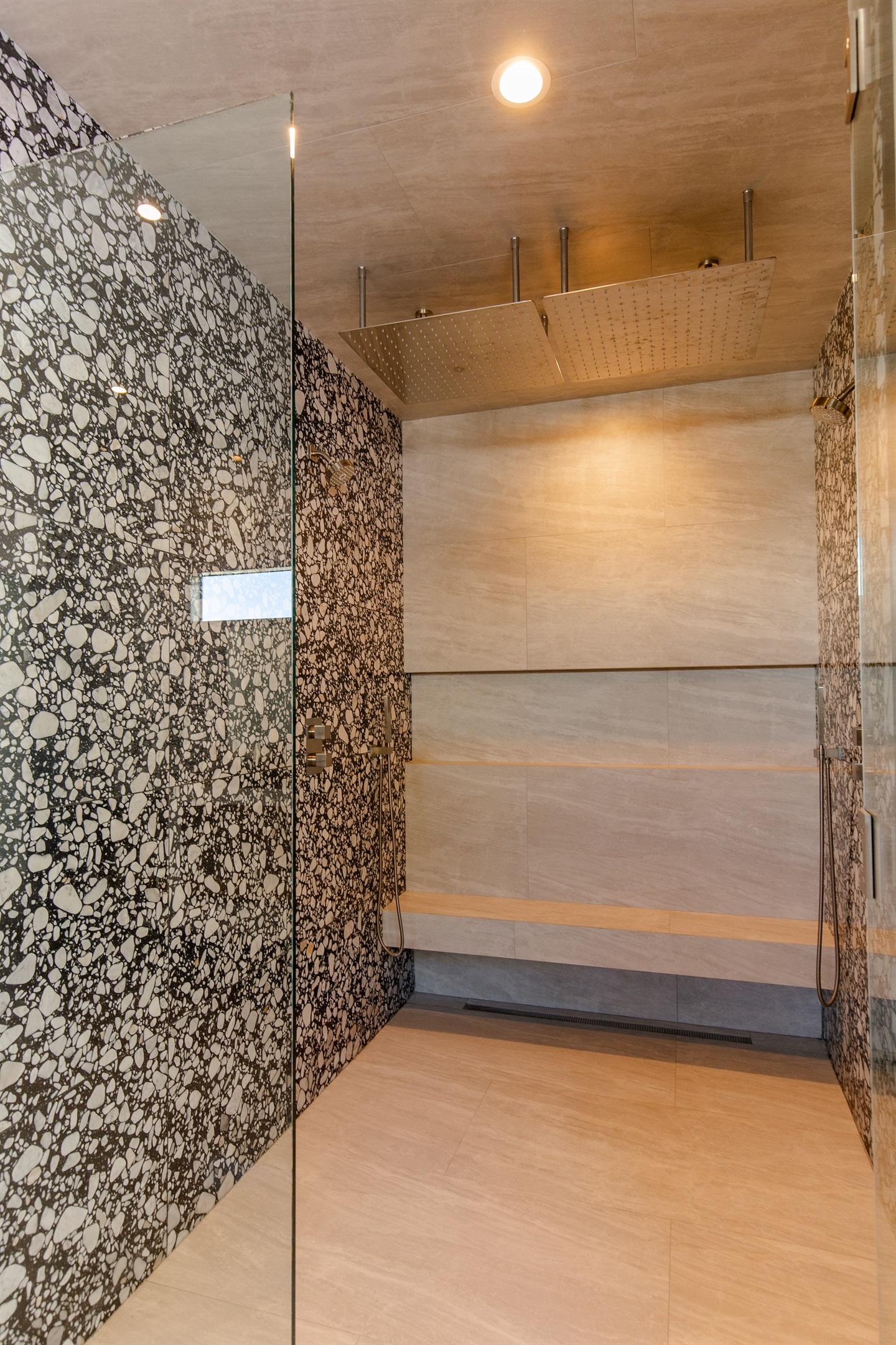 Expansive walk-in shower with 48" rainfall shower head