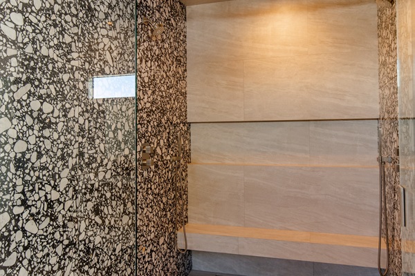 Expansive walk-in shower with 48" rainfall shower head