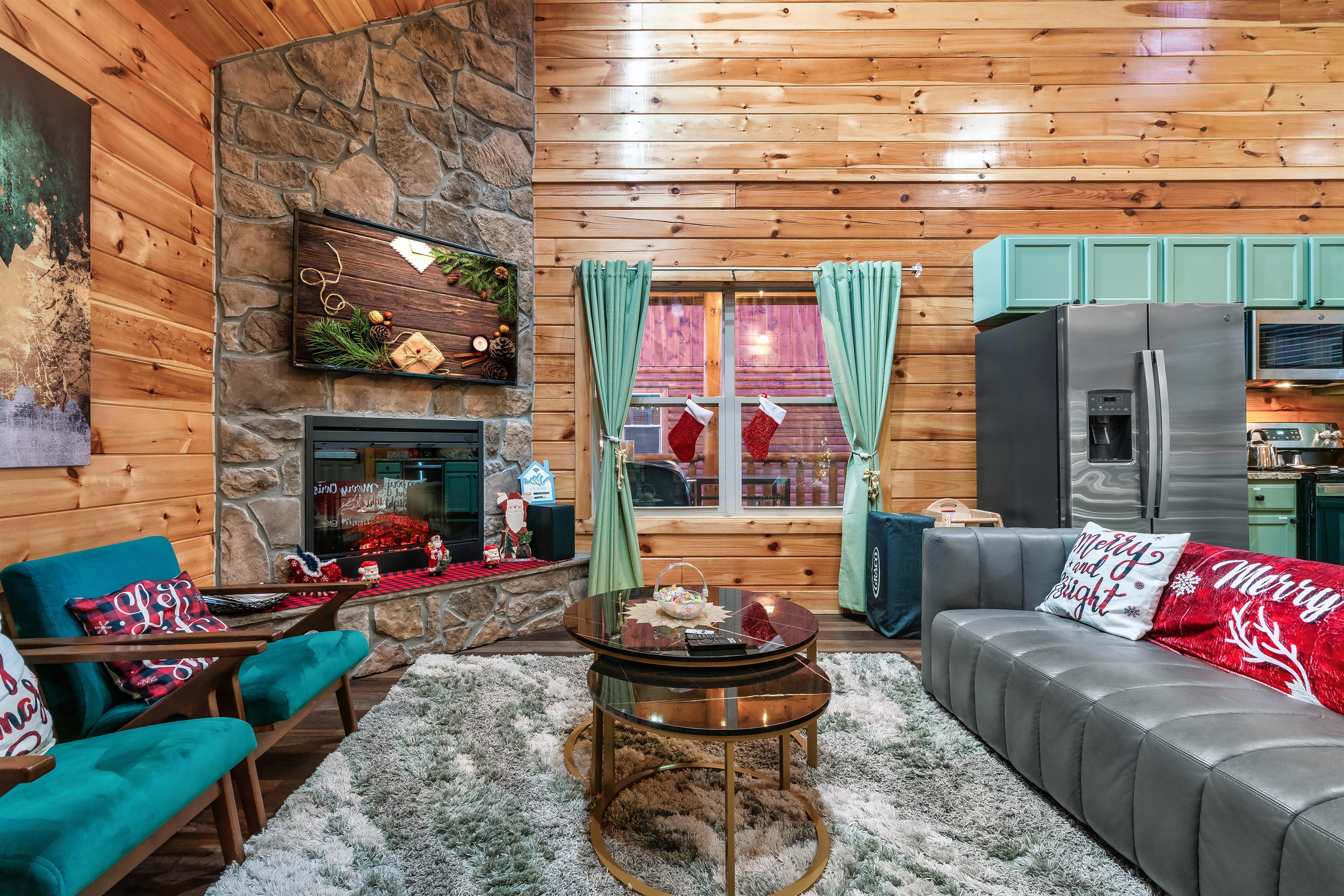 Living Room: Enjoy festive vibes with plush seating, a stone fireplace, and vibrant decor!
