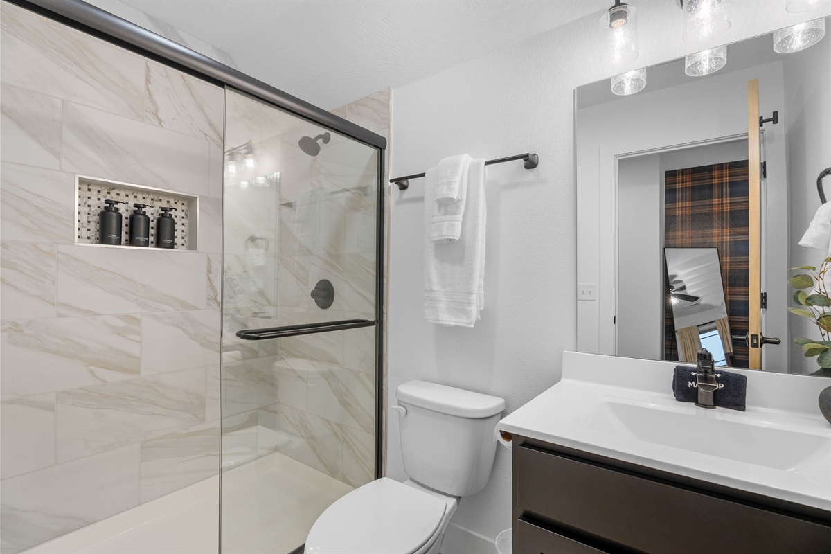 Clean, modern bathroom with a spacious walk-in shower.