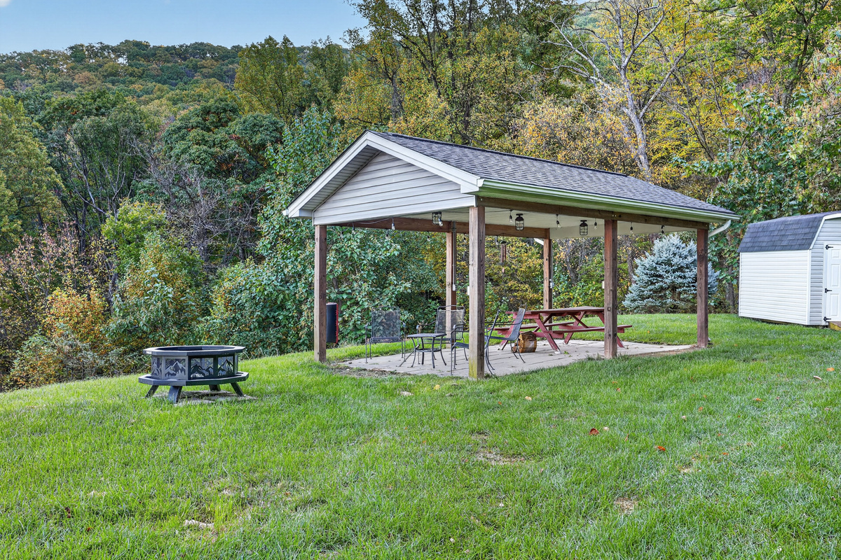 The eastern and southern views of the bordering Shenandoah National Park from the back yard fire pit and picnic pavilion with table for 6.