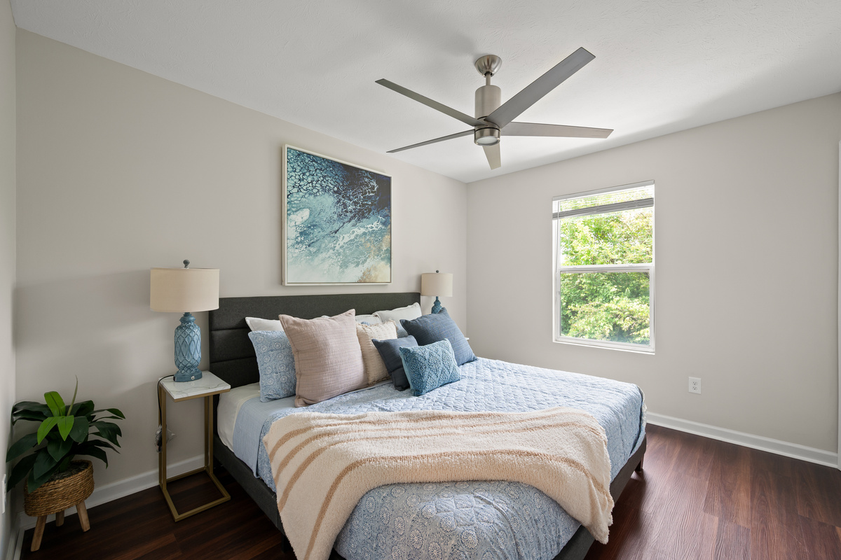 Retreat to the spacious primary bedroom with king size bed, thoughtfully designed for comfort and relaxation after a day at the Speedway or exploring downtown Indianapolis.