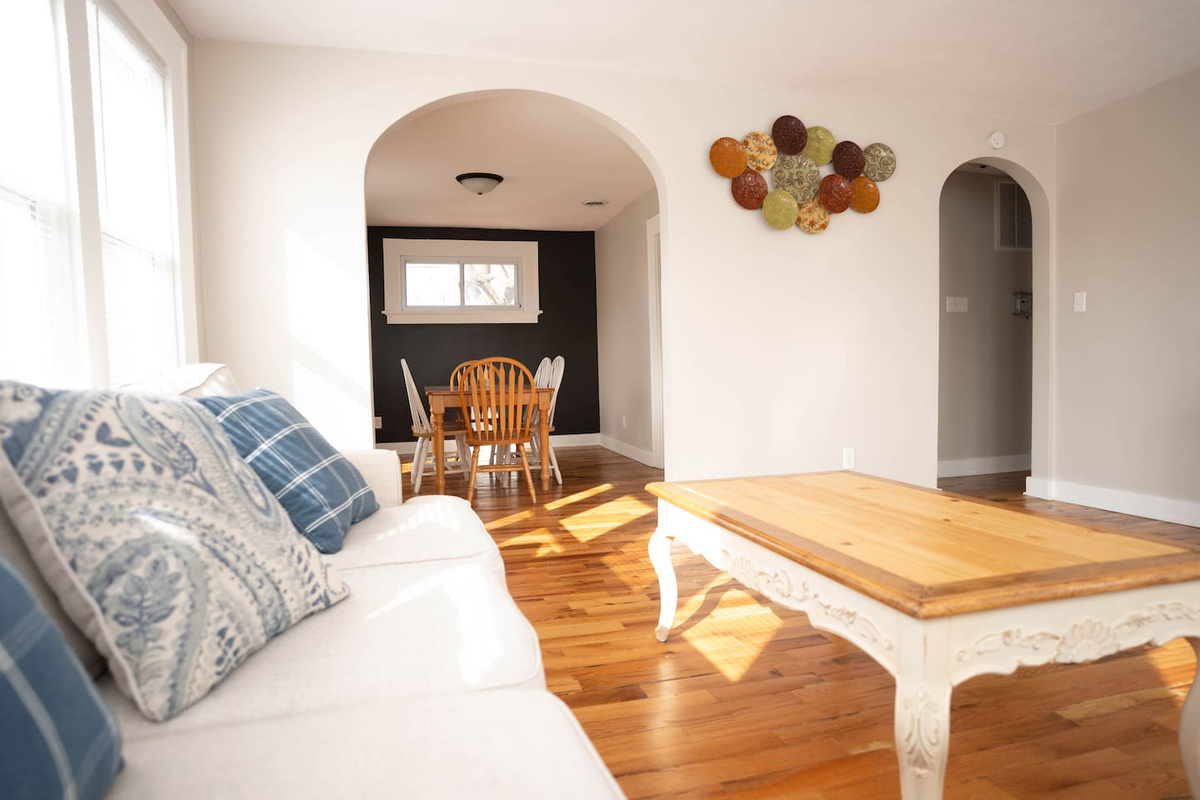 Kick back on the comfy couch, put your feet up on the coffee table, and enjoy your favorite shows on the smart TV. It’s a great spot to relax, hang out, and unwind after a long day.