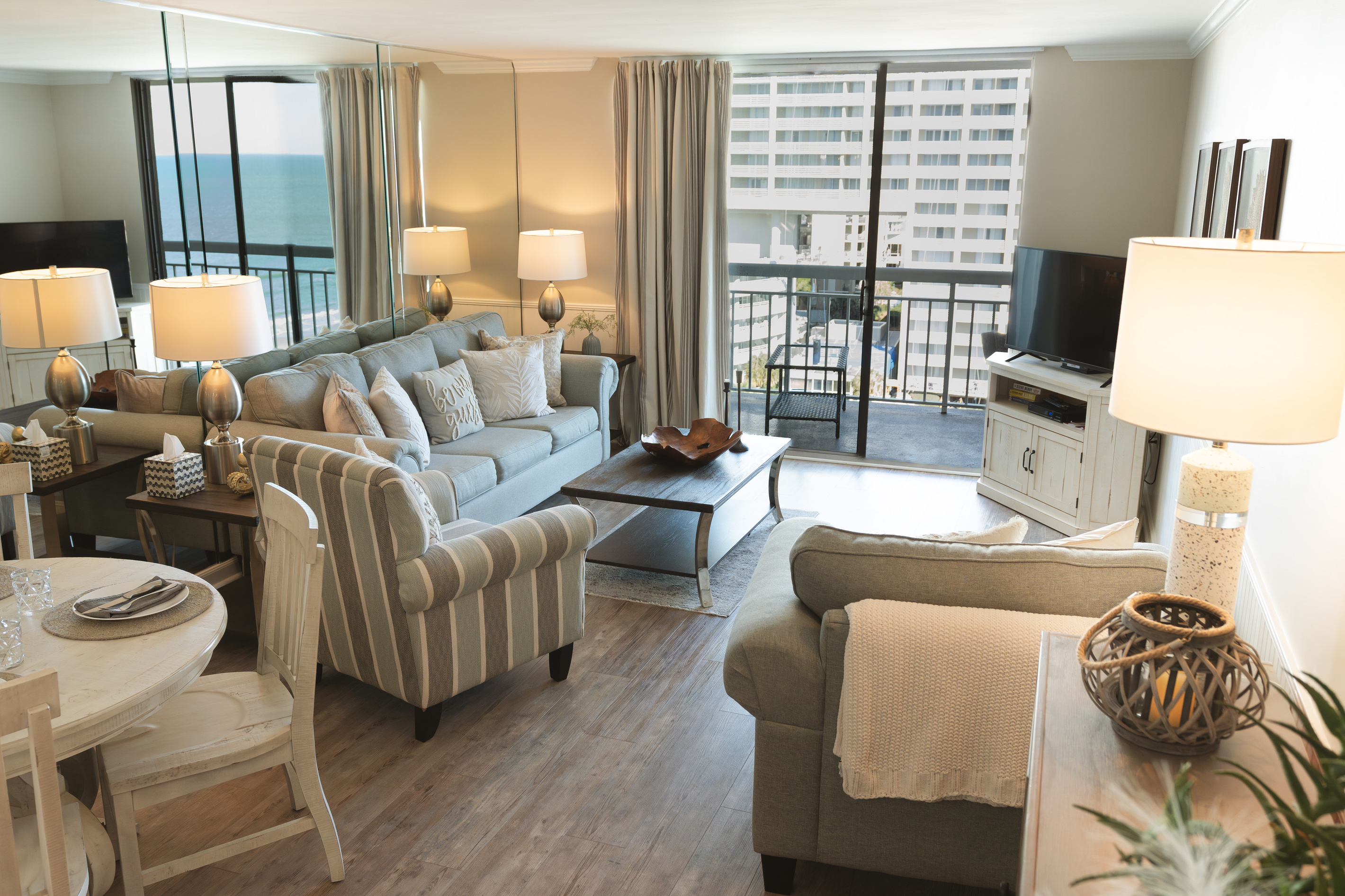 Living Room with large TV and balcony access