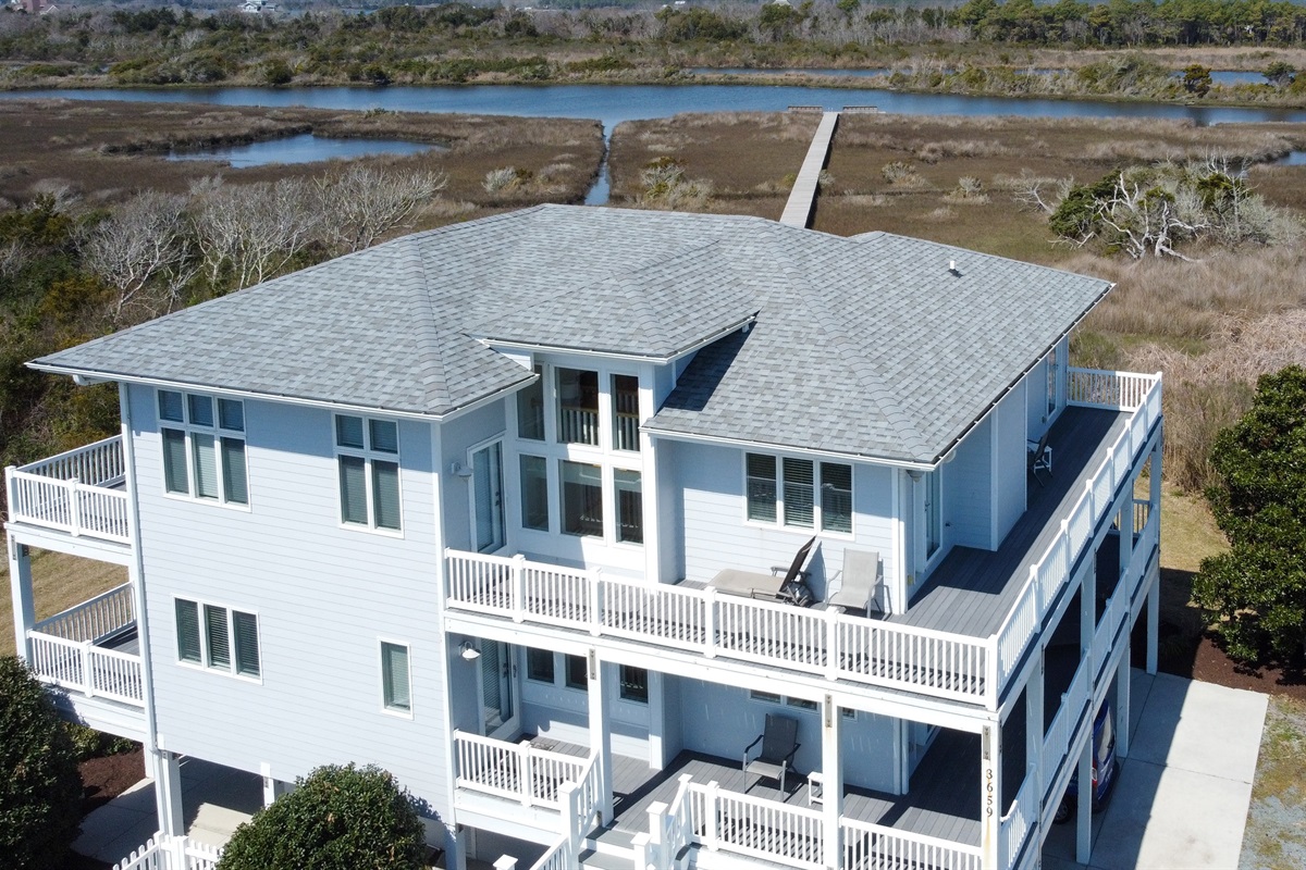 Aerial view of Soundside Solace with private marsh boardwalk and dock